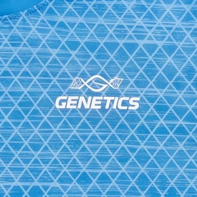 Close-up of the GENETICS chest mark on the tee