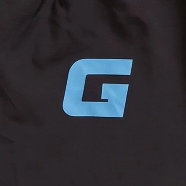 Close-up of the G lettermark on the black shorts