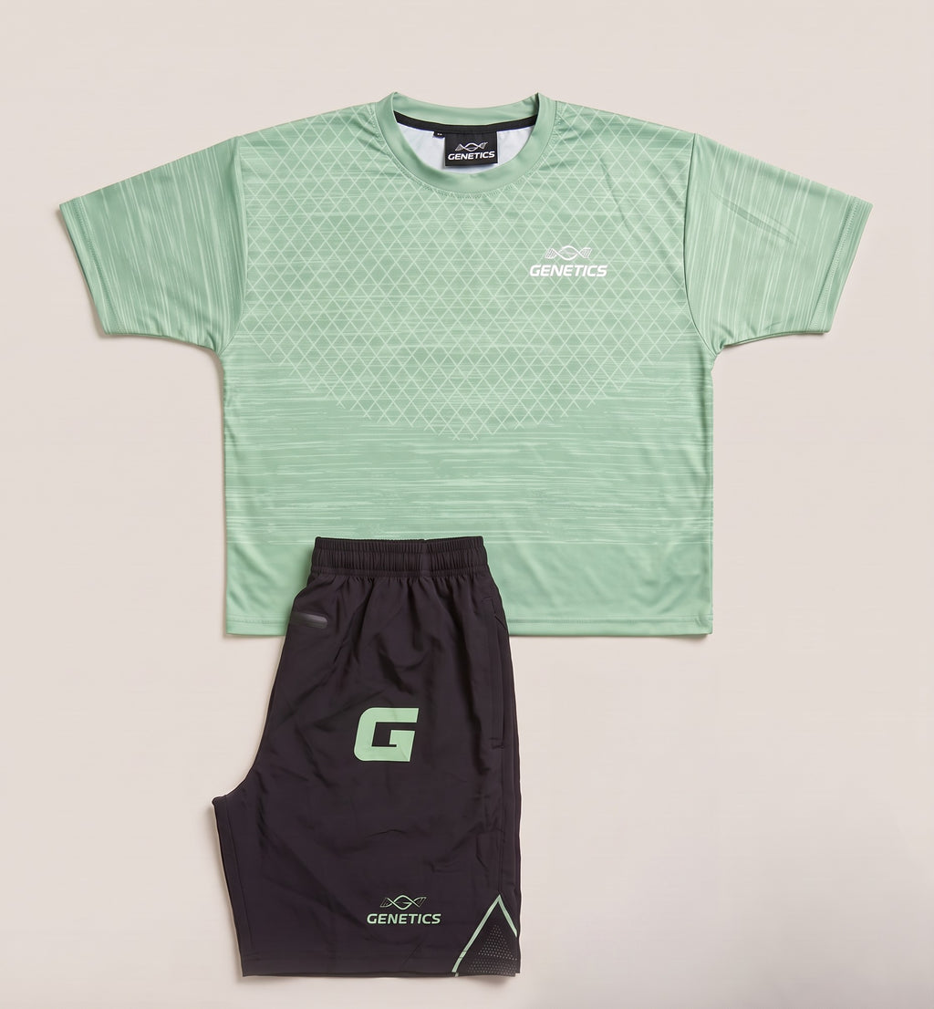 Genetics Training Kit in Green: patterned tee and black shorts with a green G lettermark, laid flat
