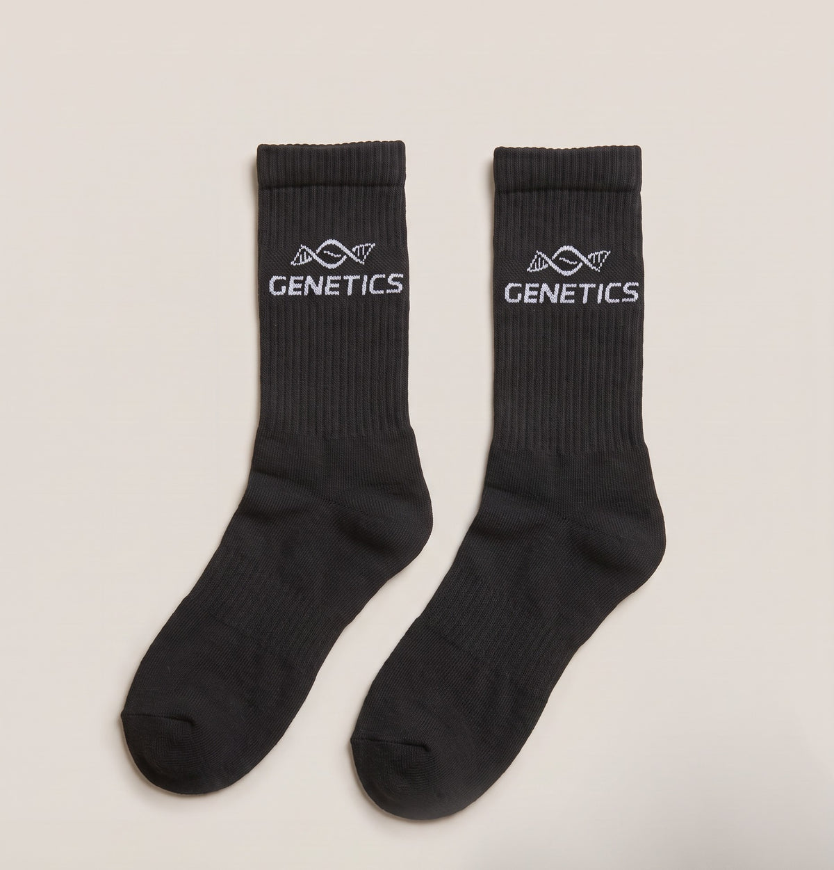A pair of black Genetics crew socks with the white GENETICS mark